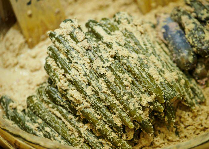 Cucumbers pickling in rice bran (nukazuke).